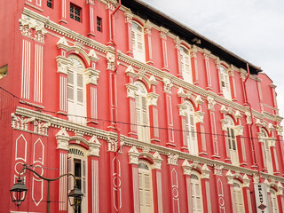 Vibrant red heritage building facade in Singapore