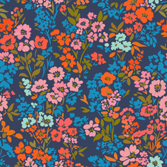 Obraz premium Seamless floral pattern with colorful hand-drawn flowers and leaves on a white background. Bright and vibrant design perfect for textiles, wallpapers, wrapping paper.