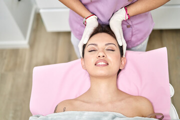 A client enjoys a soothing massage at a beauty salon