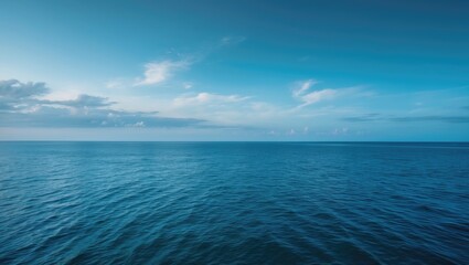 Fototapeta premium Summer ocean scene with clear sky and blue water backdrop