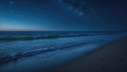 Sea waves crashing onto sandy beach beneath a starry night sky