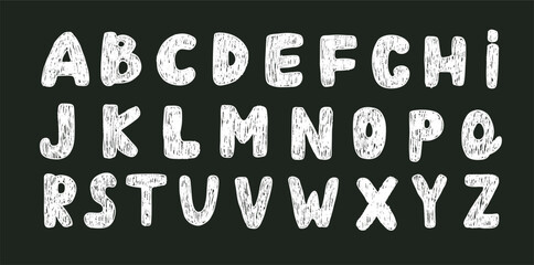 English alphabet drawing with white chalk or crayon texture effect on dark blackboard © Yulia Zelinskaya