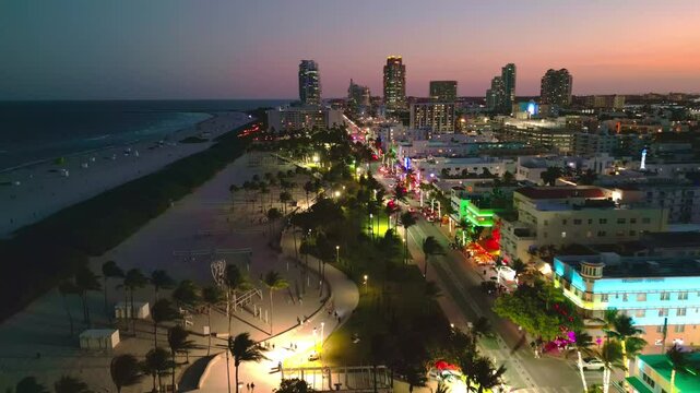 Miami Beach, Ocean Drive at night. Miami Ocean Drive seaside at dusk. Aerial view of night Miami Beach and cityscape of Ocean Drive. Ocean Drive of Miami Beach night shot from the air drone.