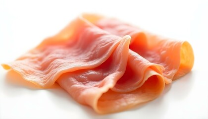 sliced prosciutto on a white background