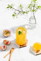 tropical Bubble Tea, Isolated on White Background. Colorful, Fresh Orange Boba Drink with Fruit Fizzy Jellies and Ice Cubes. Tapioca pearls. 