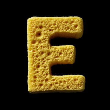 The letter "E" made of yellow sponge