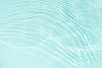 Blue water with ripples on the surface. Defocus blurred transparent blue colored clear calm water...