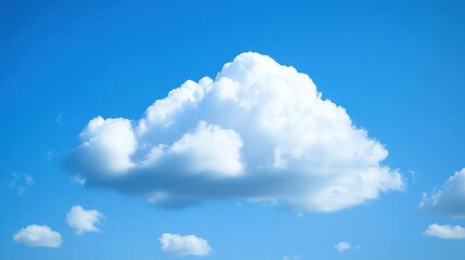 Fototapeta premium Fluffy white cumulus cloud against a vibrant blue sky