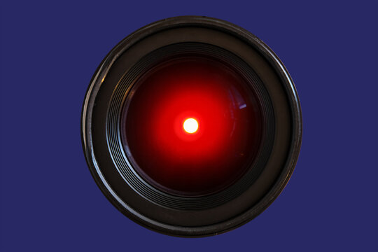 Close-up of a camera lens with glowing red light. Symbolizes machine vision, robotics, and futuristic AI technology. Perfect for tech, security, and sci-fi concepts.