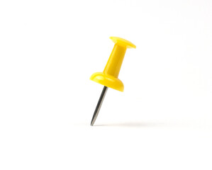 Bright yellow push pin stands upright on white background