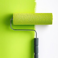 Obraz premium Close-up of paint roller applying vibrant green paint on white wall, concept of home renovation and interior design