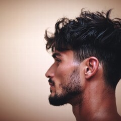 Obraz premium A portrait of a young man with a messy haircut and a playful expression captured outdoors