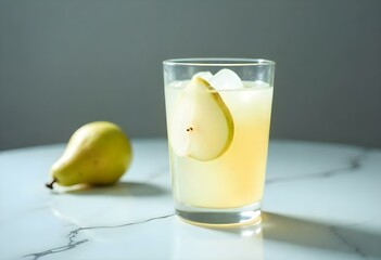 glass of pear juice on a white background