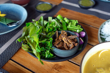 Southern-style Thai cuisine and seafood dishes are beautifully arranged on the table, looking incredibly appetizing.