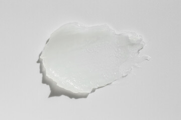 Moisturizing lip balm on white background, top view