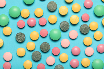 Colorful pills on blue background