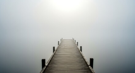 Obraz premium Wooden Dock Extending into a Foggy Lake – Tranquil Nature Scene