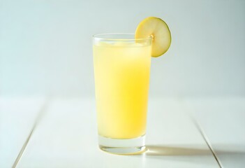 glass of pear juice on a white background