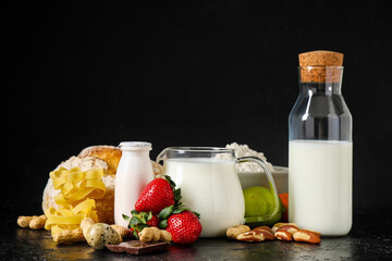 Different products on black table. Food Allergy Awareness Month
