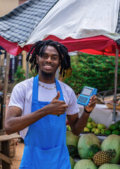 excited african black business man using NFC payment, using point of sale machine