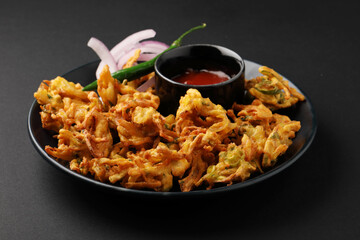 Indian street food snack called onion pakoda making gram flour and onion