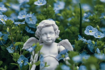 Cute little cherub figurine in Georgia blue flowers on abandoned gravel and sorrow memories, soft...