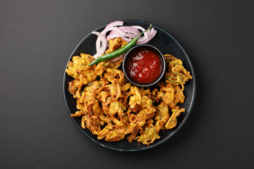 Indian street food snack called onion pakoda making gram flour and onion