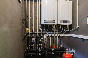 interior apartment room boiler room. heating system, pipes and appliances