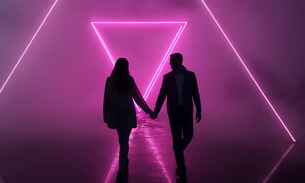 Silhouette couple walking towards pink triangle light installation romantic dreamy purple hazy