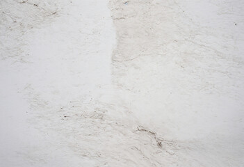 Fototapeta premium Closeup of a white wall, great for backgrounds, construction websites, interior design blogs, minimalist concepts, and texture references.