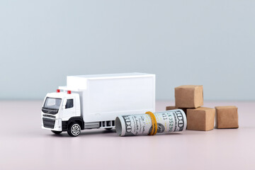White toy truck with boxes on a light background, space for text.