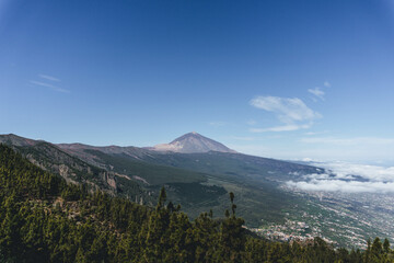 Fototapeta premium volcano teide view with arid desert landscape and blue sky with volcanic vegetation on top of island
