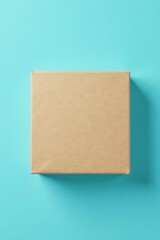 Fototapeta premium Simple flat design of a cardboard box on light blue backdrop for branding concept, template, showcase