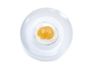 Fried egg with double yolk on white plate isolated on white background, Top view 