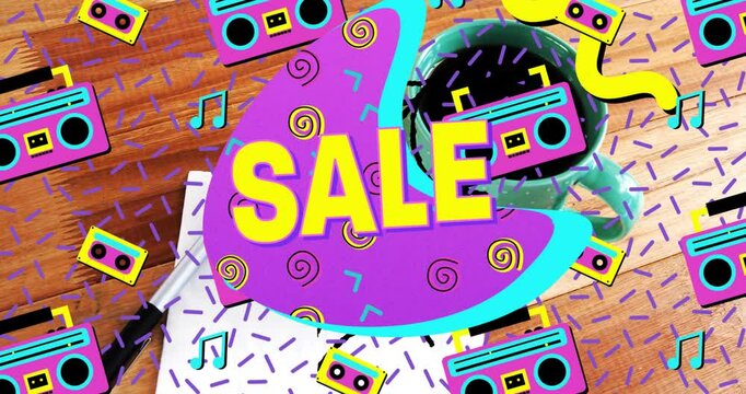 Promotional SALE graphic glowing over desk, featuring neon retro shapes and cassette icons