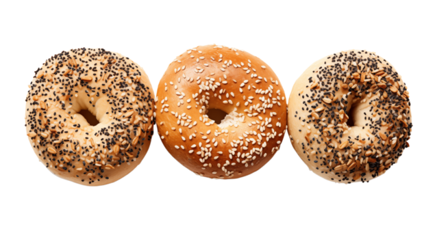 A close up of three bagels with different toppings arranged side by side on a transparent background png