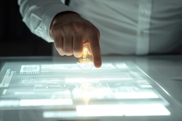 A hand gently holds a glowing lightbulb above a futuristic digital interface, symbolizing innovation and new ideas.