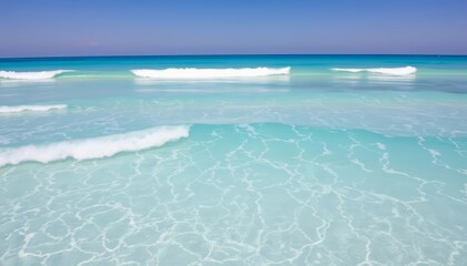 Obraz premium Crystal-clear turquoise waves crash gently on a pristine shore, waves, ocean texture
