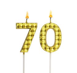 Burning gold birthday candles isolated on white background, number 70.	
