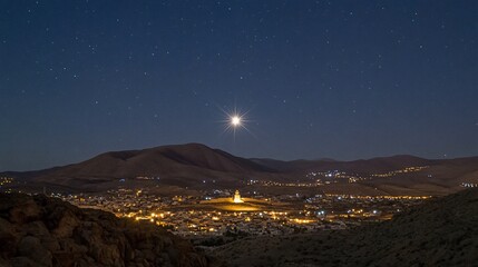 Starry night view of illuminated town nestled in valley