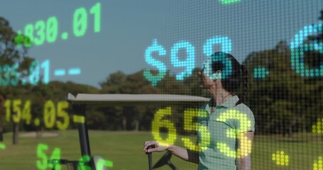 Businesswoman practicing golf swing on course, projecting live stock market numbers - Powered by Adobe