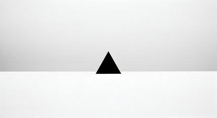 Fototapeta premium Black Triangle On Clean White Minimalist Background For Contemporary Design