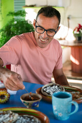 Tourist enjoying traditional mexican breakfast with tlayudas 