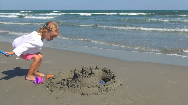 Child Playing on Beach, Little Girl Having Fun with a Sand Castle, Kid on Seashore, Children