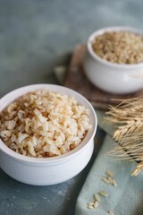 Cooked brown rice served in a bowl, selective focus