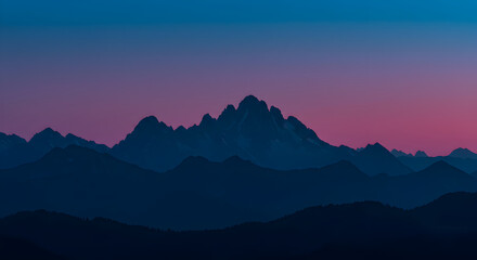 Obraz premium Majestic Mountains Silhouette Against a Dusk Sky Serene Landscape