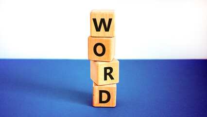 Word symbol. Concept word Word on beautiful wooden blocks. Beautiful white and blue background....