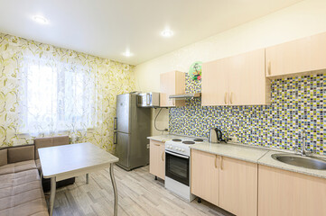 interior apartment kitchen and dining room, refectory area, cooking equipment, table furniture, stove