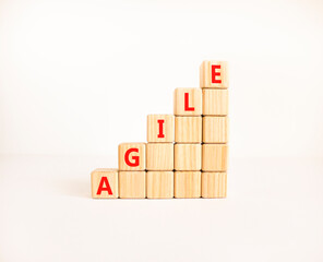 Agile symbol. Concept word Agile on beautiful wooden blocks. Beautiful white table white...
