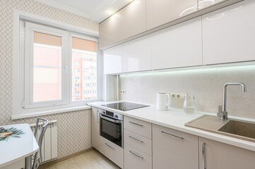 interior apartment kitchen and dining room, refectory area, cooking equipment, table furniture, stove